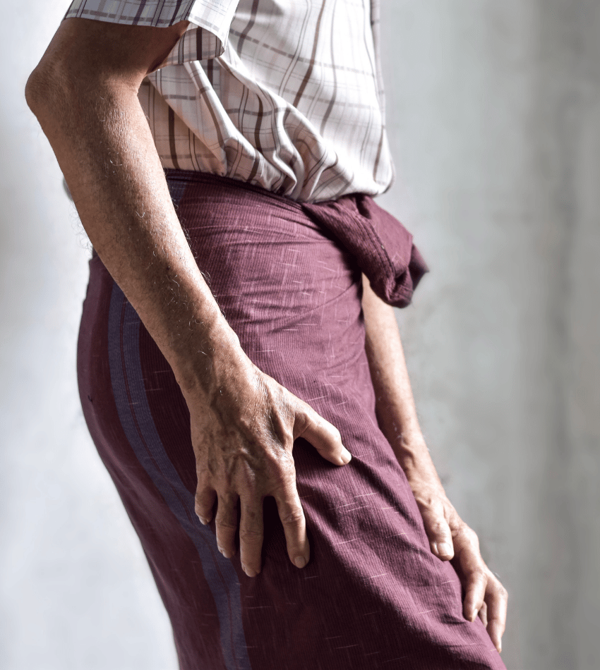 Person holding their thigh.