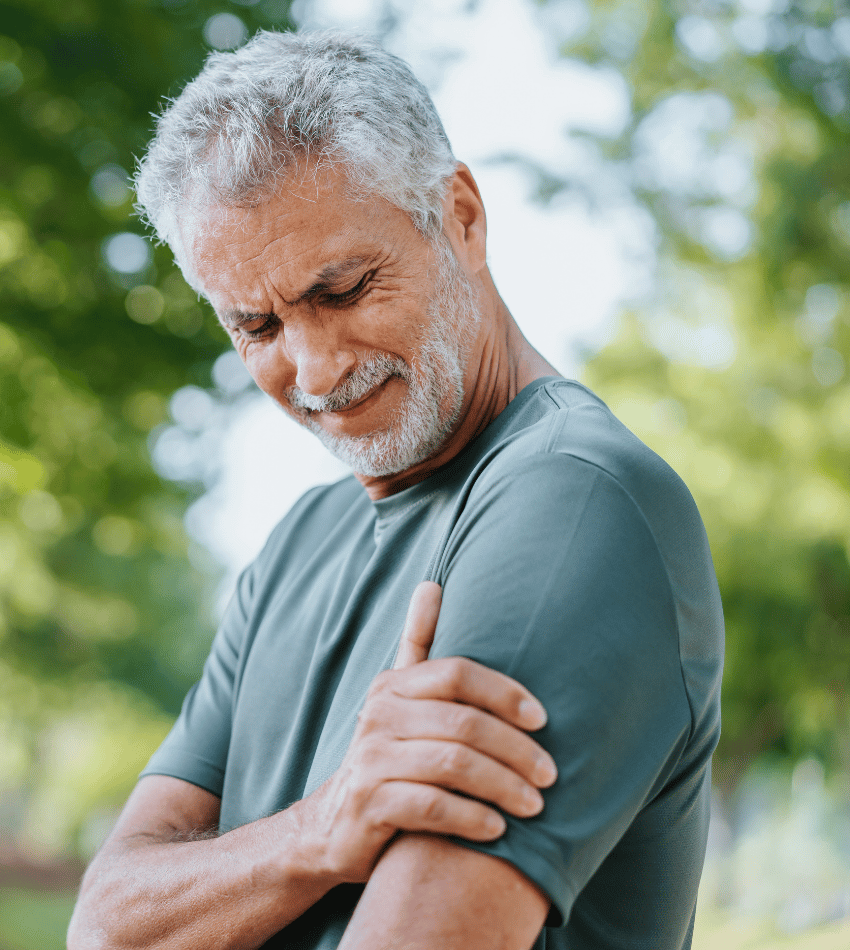 Man holding his arm in pain